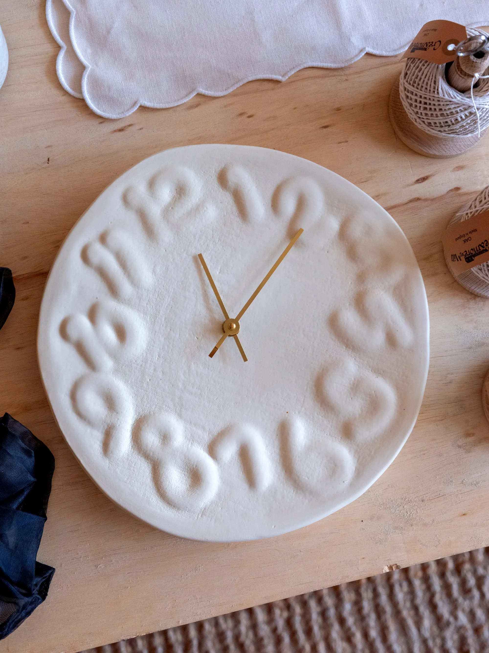 Embossed Numbered Clock in White