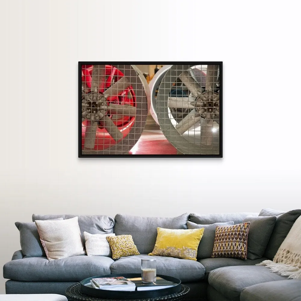 "Close up of industrial fans behind metal grate" Black Float Frame Canvas Art