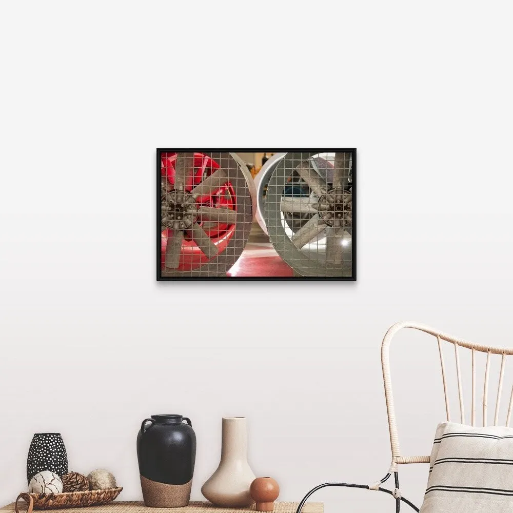 "Close up of industrial fans behind metal grate" Black Float Frame Canvas Art